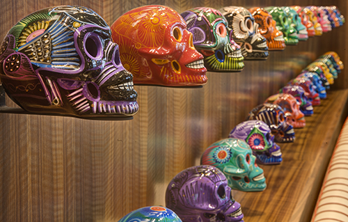 Sugar skulls hand painted in Mexico adorn the walls at Torre